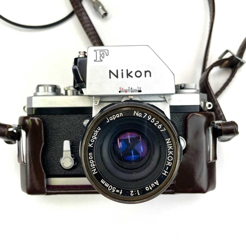 307 - A Nikon F Photomatic FTn serial number 6875184. Fitted with Nikkor-H Auto 1:2 50mm No. 795267 togeth... 