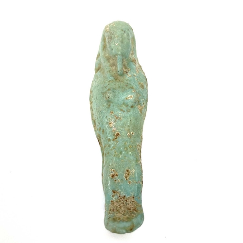 308 - An Egyptian faience shabti. Together with other Egyptian faience and pottery shabti. (4)