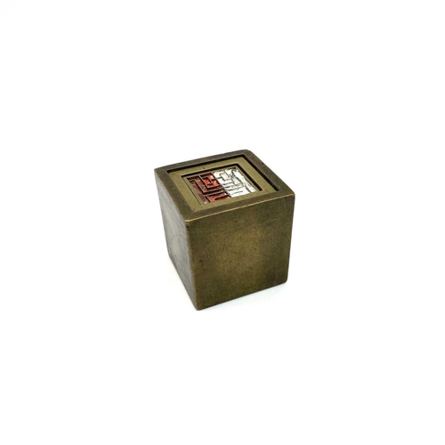 309 - A Chinese brass seal cube. With an inner fitted brass cube and interchangeable seal marks.