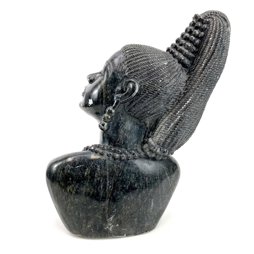 311 - Douglas Chitiyo, A soapstone carving of an African lady. Bust length, wearing a bead necklace, signe... 