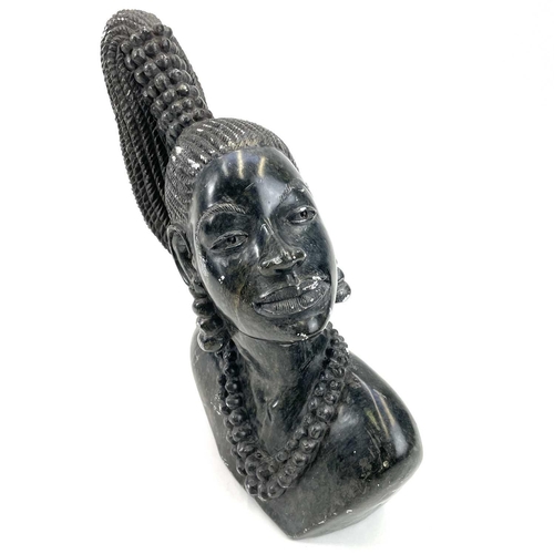 311 - Douglas Chitiyo, A soapstone carving of an African lady. Bust length, wearing a bead necklace, signe... 