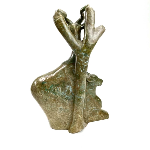 312 - An African carved green stone figure of a deer. Height 38cm.