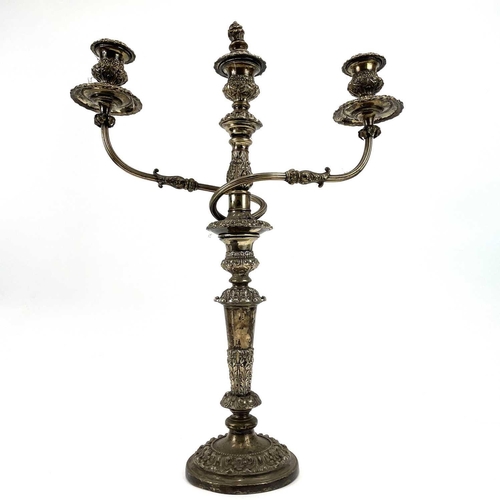 314 - An Old Sheffield Plate three-sconce candelabrum. Height 57cm. Together with a pair of similar candle... 