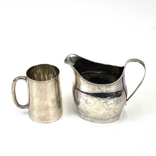 319 - A George III silver milk jug, with a reeded handle. Together with a Mappin & Webb silver Christening... 