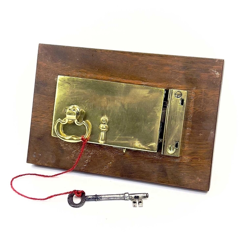 33 - A Georgian brass door lock. With original handles and key, width of lock 17.5cm.