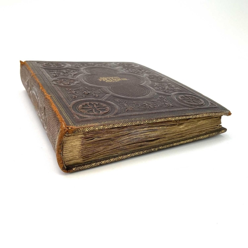 334 - A Victorian scrap album bound in embossed leather. .