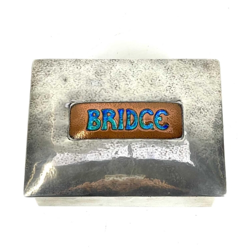 402 - A Liberty & Co Tudric pewter and copper enamel Bridge box. Stamped, 0414 English Pewter Liberty & Co... 