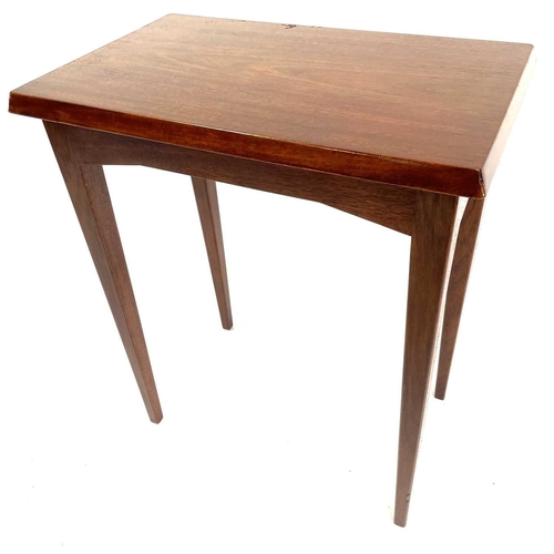 403 - A Heal's mahogany rectangular occasional table. Raised on square taper legs, with applied label to t... 