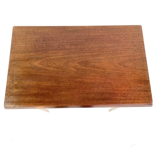 403 - A Heal's mahogany rectangular occasional table. Raised on square taper legs, with applied label to t... 