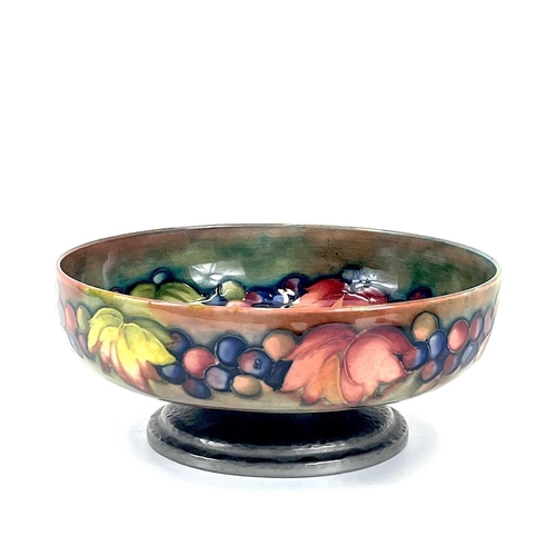 405 - A Liberty & Co Tudric pewter mounted Moorcroft pottery footed bowl. Leaf and Berry pattern stamped T... 