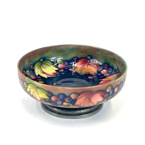 405 - A Liberty & Co Tudric pewter mounted Moorcroft pottery footed bowl. Leaf and Berry pattern stamped T... 