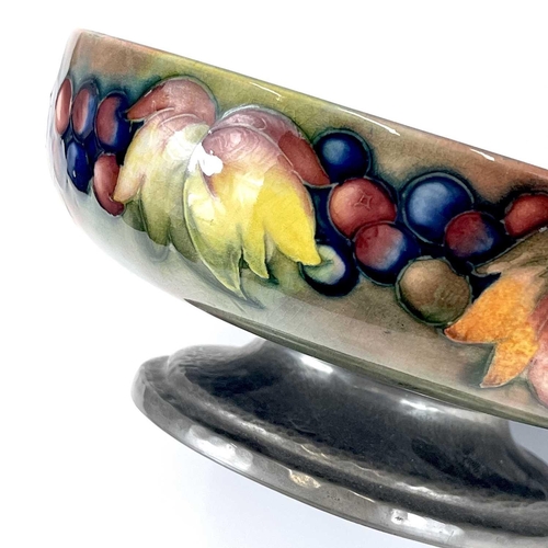 405 - A Liberty & Co Tudric pewter mounted Moorcroft pottery footed bowl. Leaf and Berry pattern stamped T... 