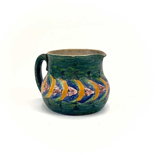 406 - Ella Napper, Lamorna, A painted pottery jug. Initialled and inscribed to the base, height 9cm.