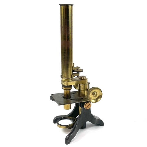 41 - A late Victorian brass microscope. Contained in a mahogany box, height 24cm.