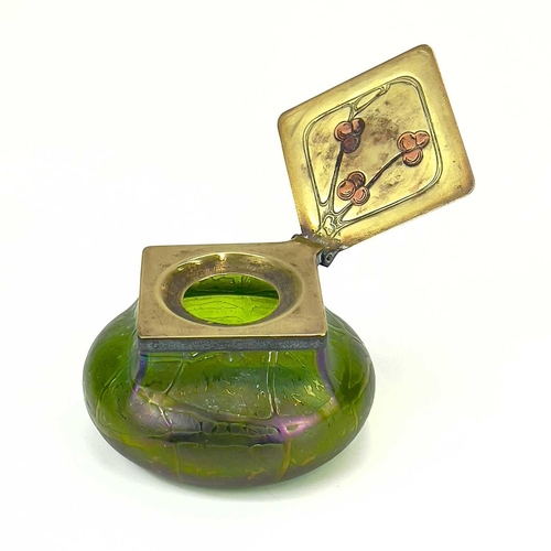 414 - A Loetz type iridescent glass inkwell. Possibly Kralik, the lozenge shape brass cover with copper hi... 