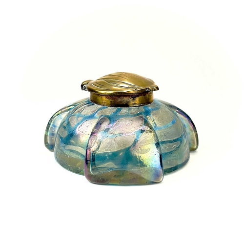 417 - A Kralik iridescent glass inkwell. The lobed circular body with green trailed decoration and embosse... 