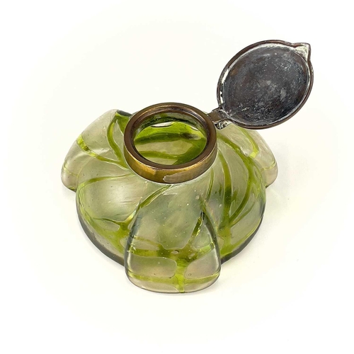 417 - A Kralik iridescent glass inkwell. The lobed circular body with green trailed decoration and embosse... 