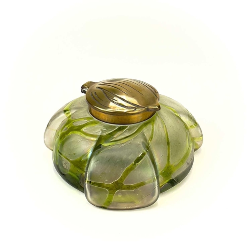 417 - A Kralik iridescent glass inkwell. The lobed circular body with green trailed decoration and embosse... 