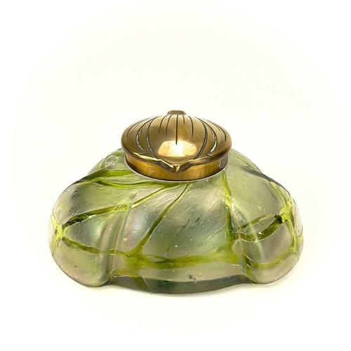 417 - A Kralik iridescent glass inkwell. The lobed circular body with green trailed decoration and embosse... 