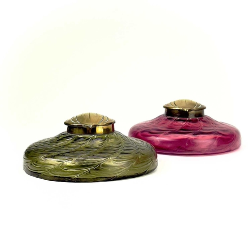 418 - A circular ruby glass inkwell, probably Kralik. With a web of trailed decoration and embossed brass ... 