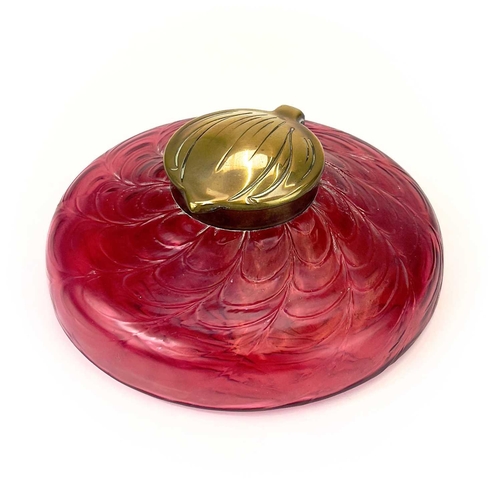 418 - A circular ruby glass inkwell, probably Kralik. With a web of trailed decoration and embossed brass ... 