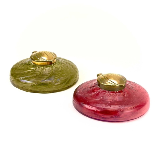 418 - A circular ruby glass inkwell, probably Kralik. With a web of trailed decoration and embossed brass ... 