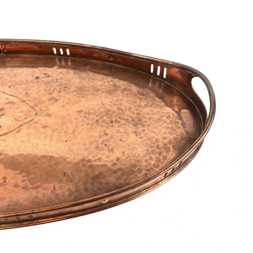 42 - A Newlyn copper oval galleried tray. With twin handles, width 50.5cm.