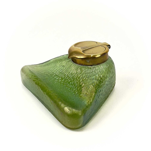 421 - A Loetz type iridescent glass circular inkwell. With trailed decoration and brass cover, height 6.5c... 