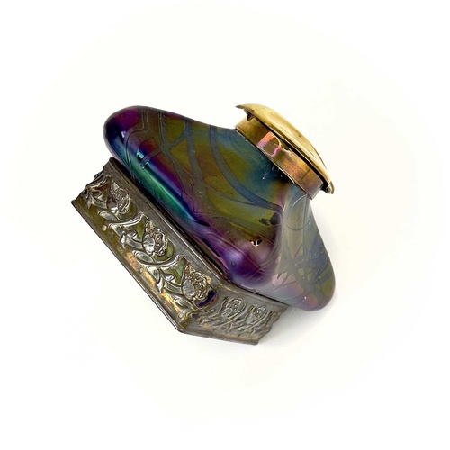 424 - An iridescent glass inkwell, probably Loetz. Of lobed square form with typical trailed decoration an... 