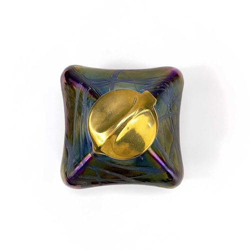 424 - An iridescent glass inkwell, probably Loetz. Of lobed square form with typical trailed decoration an... 