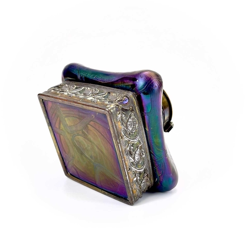 424 - An iridescent glass inkwell, probably Loetz. Of lobed square form with typical trailed decoration an... 