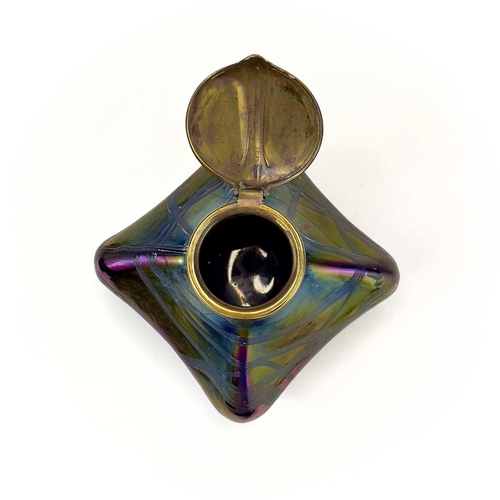 424 - An iridescent glass inkwell, probably Loetz. Of lobed square form with typical trailed decoration an... 