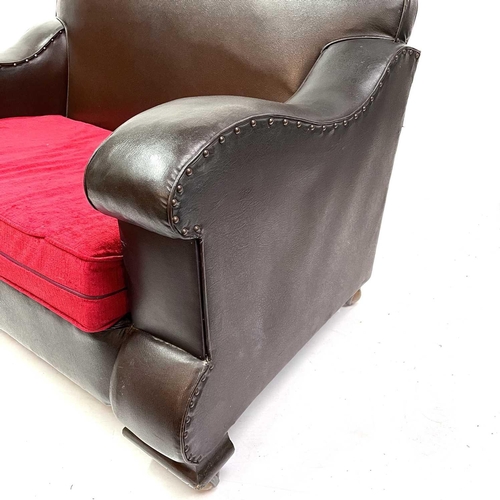 451 - An Art Deco two-seater leatherette settee. With shaped back and arms, and upholstered cushion. Heigh... 