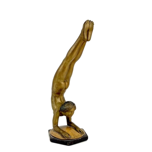 453 - An Art Deco bronze painted plaster figure of a female acrobat. Stamped O P 406 RD825881, height 45cm... 