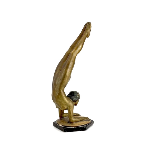 453 - An Art Deco bronze painted plaster figure of a female acrobat. Stamped O P 406 RD825881, height 45cm... 