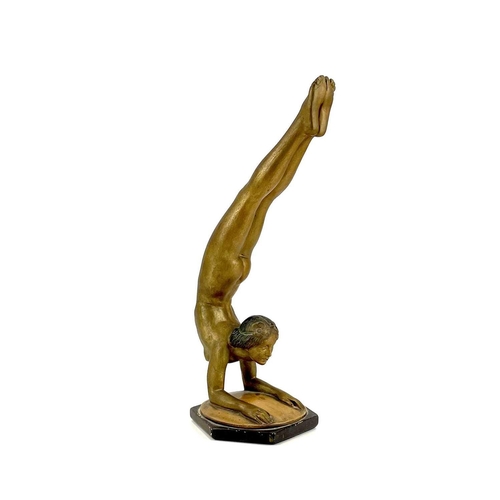 453 - An Art Deco bronze painted plaster figure of a female acrobat. Stamped O P 406 RD825881, height 45cm... 