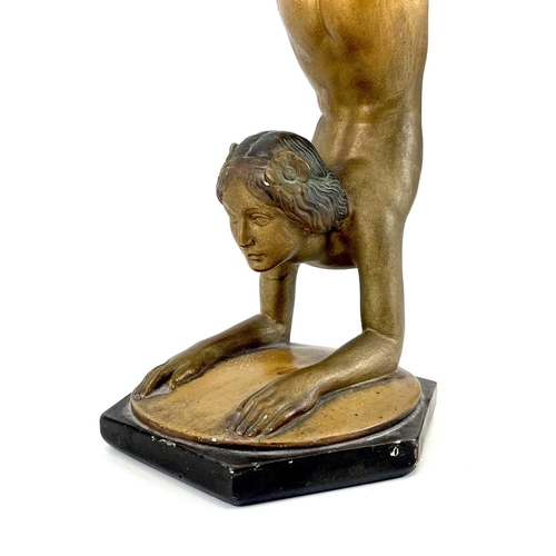 453 - An Art Deco bronze painted plaster figure of a female acrobat. Stamped O P 406 RD825881, height 45cm... 