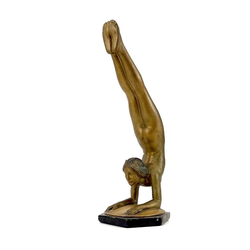 453 - An Art Deco bronze painted plaster figure of a female acrobat. Stamped O P 406 RD825881, height 45cm... 