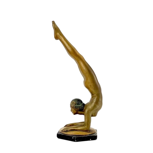 453 - An Art Deco bronze painted plaster figure of a female acrobat. Stamped O P 406 RD825881, height 45cm... 