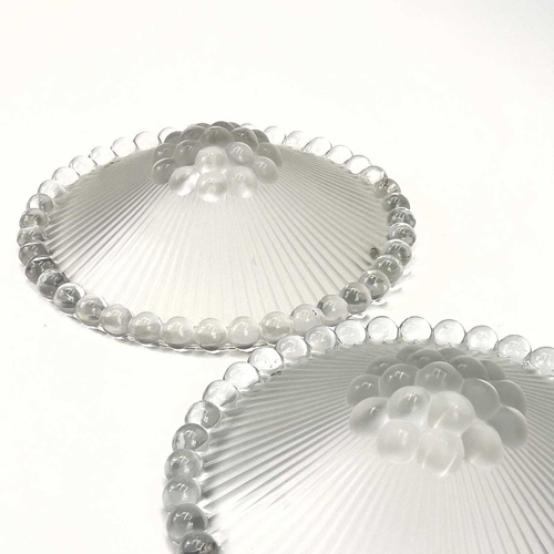 455 - A pair of Lalique ceiling light shades. Signed R Lalique France, diameter 29cm.