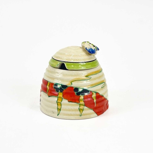 458 - A Clarice Cliff Fantastique beehive honey pot and cover. Decorated in the solitude pattern with appl... 