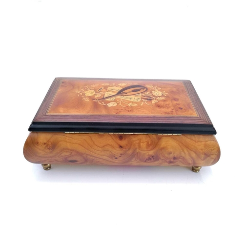 47 - A Swiss Reuge Romance musical jewellery box. Playing Edelweiss, contained in an Italian burr maple a... 