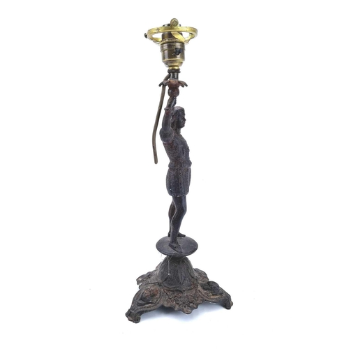 48 - A German cast iron table lamp by Zimmermann Hanau. Late 19th century, modelled as a page in medieval... 