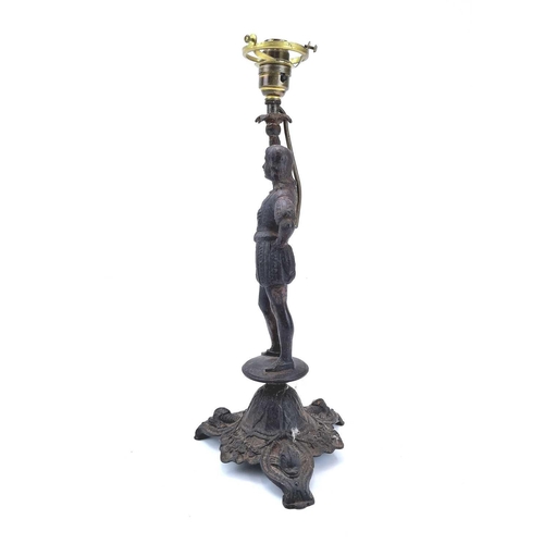 48 - A German cast iron table lamp by Zimmermann Hanau. Late 19th century, modelled as a page in medieval... 