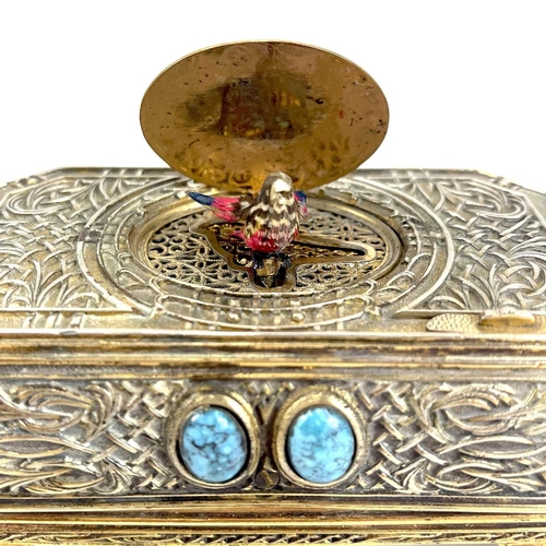 50 - A 20th century German gilt metal bird automaton music box. Decorated with scrolling tendrils and lat... 