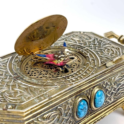 50 - A 20th century German gilt metal bird automaton music box. Decorated with scrolling tendrils and lat... 