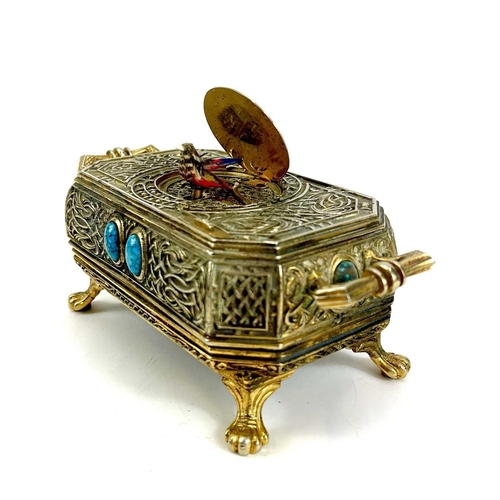 50 - A 20th century German gilt metal bird automaton music box. Decorated with scrolling tendrils and lat... 