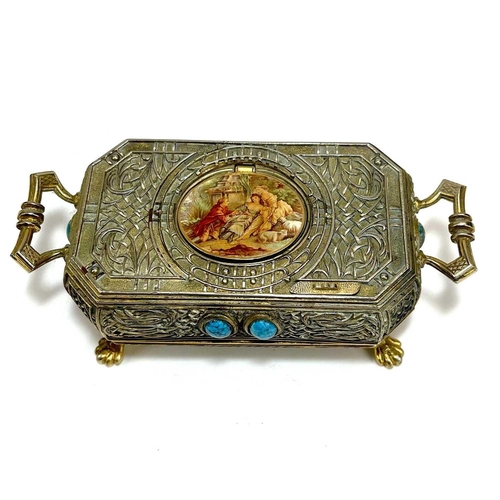 50 - A 20th century German gilt metal bird automaton music box. Decorated with scrolling tendrils and lat... 