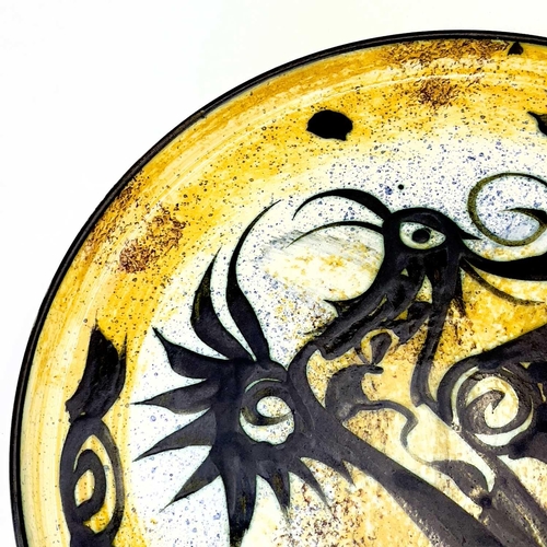 503 - A Celtic pottery tray. Decorated with a bird. Diameter 32.5cm.