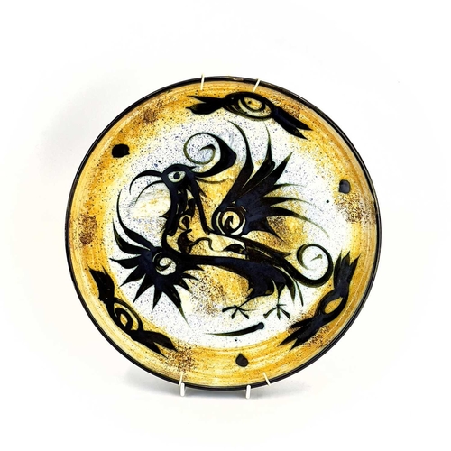 503 - A Celtic pottery tray. Decorated with a bird. Diameter 32.5cm.